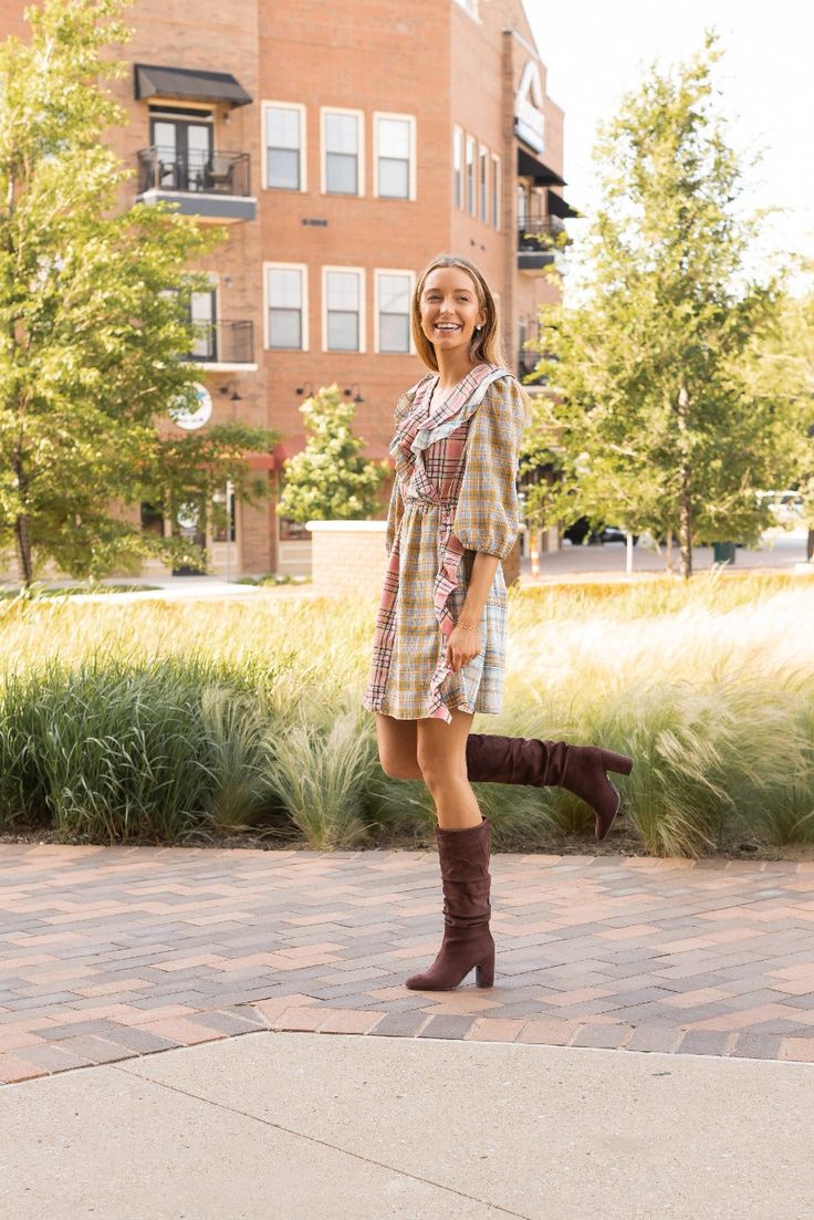 The Pink and Yellow Plaid Dress is an adorable fashion choice that radiates charm and playfulness. Featuring a delightful grid pattern of intersecting horizontal and vertical lines, this dress combines sweet pink and cheerful yellow hues for an irresistibly cute and lively look. Material: 100% Cotton Fit: True to Size Model: Wearing size Small Cute Knee-length Dresses For Fall, Cute Knee-length Fall Dresses, Trendy Plaid Mini Dress For Spring, Trendy Mini Length Spring Plaid Dress, Spring Plaid Dress For A Day Out, Plaid Dress For Day Out In Spring, Plaid Dress For Spring Day Out, Cute Fall Mini Dress With Ruffles, Spring Plaid Midi Dress