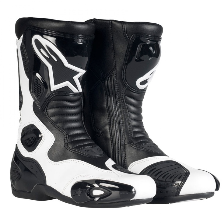 a pair of black and white motorcycle boots