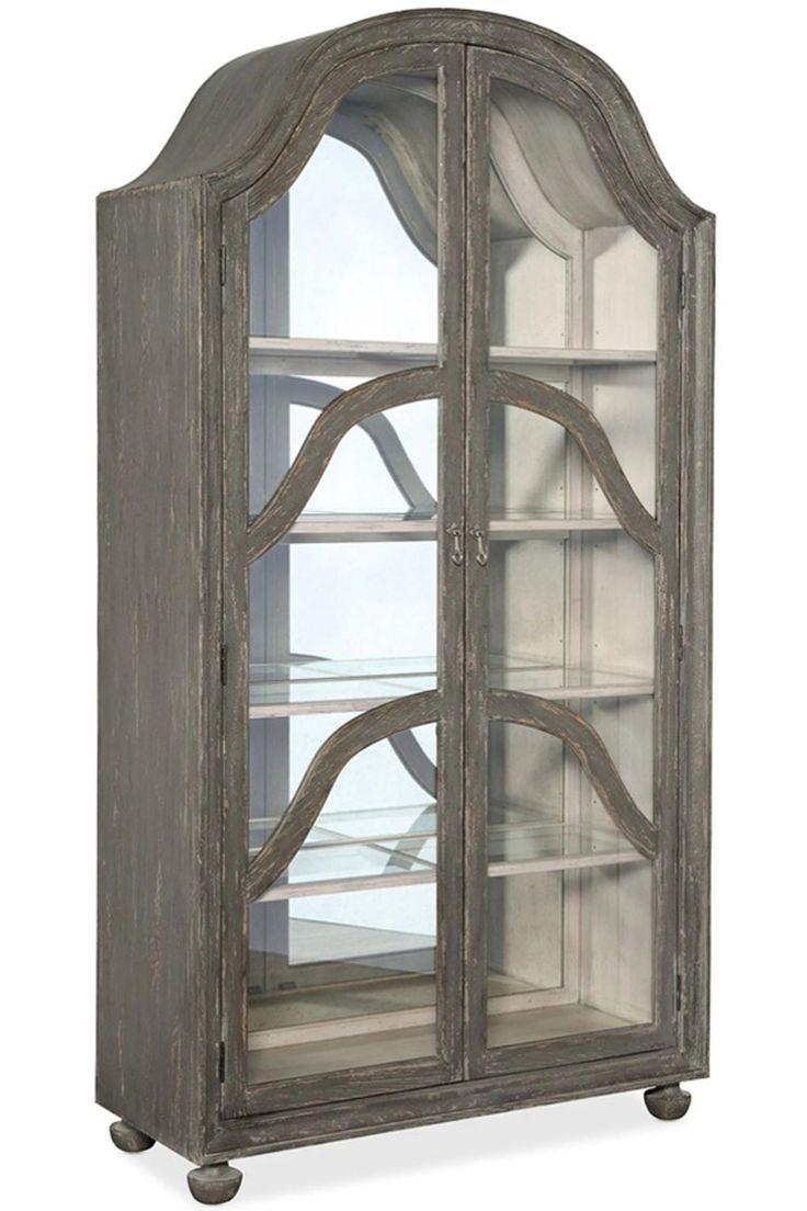 an old wooden display case with glass doors