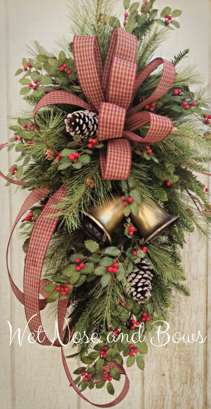 a christmas wreath with bells and pine cones