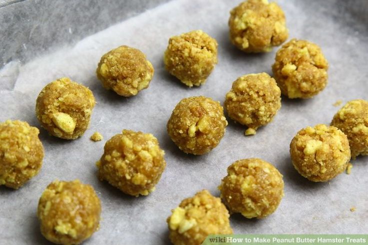 several balls of food sitting on top of a piece of parchment paper next to each other