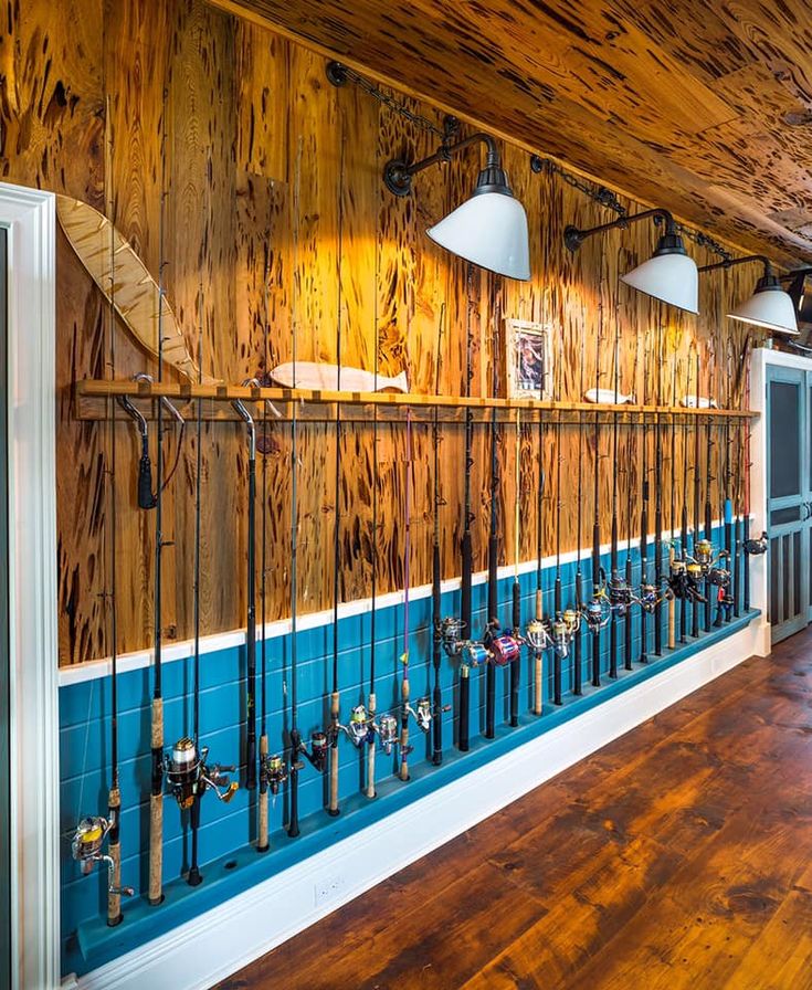 the inside of a building with wooden walls and blue paint on the wall, along with wood flooring