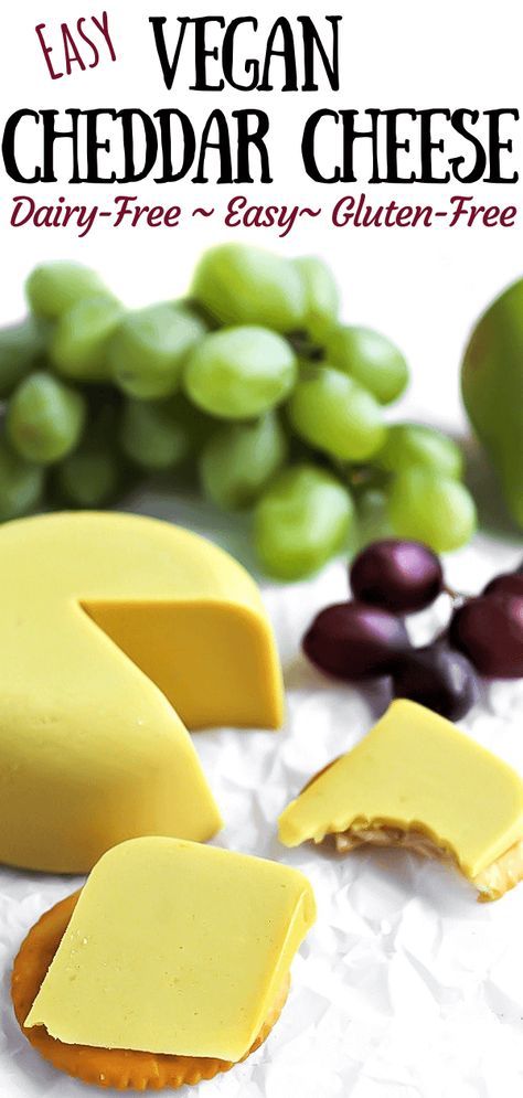 easy vegan cheddar cheese is cut into pieces and served with grapes on the side