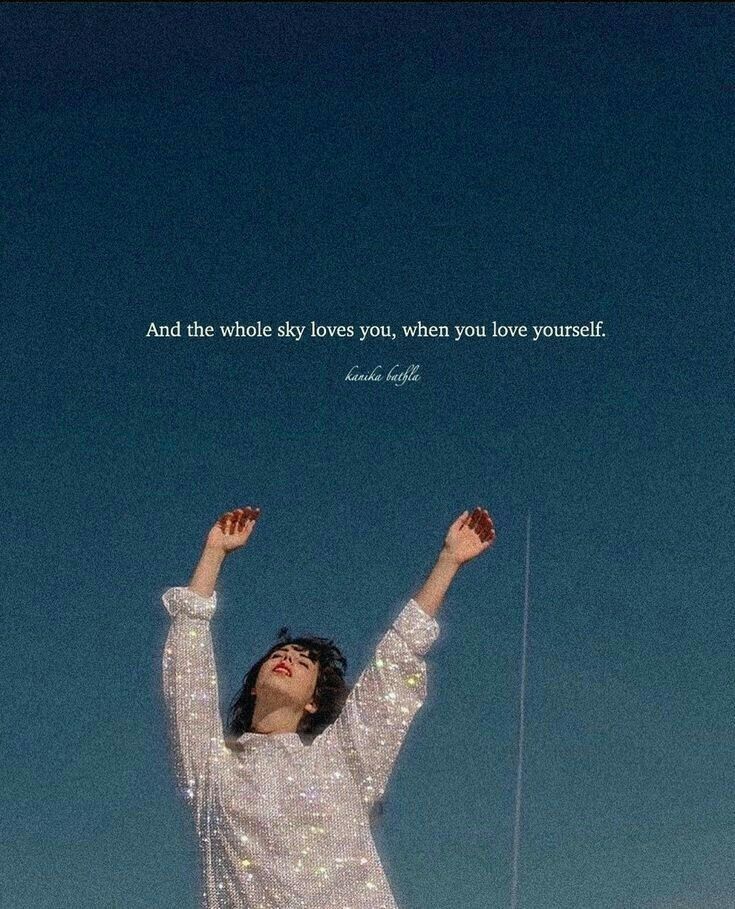 a woman with her arms up in the air and a quote above her that says, and the whole sky loves you, when you love is yourself