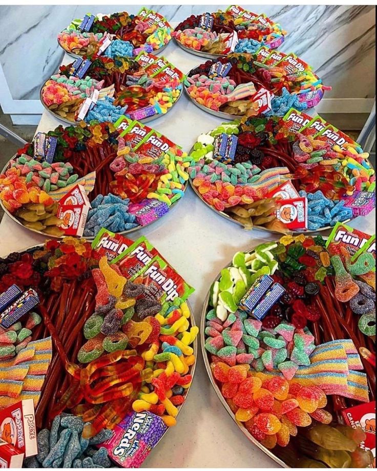 a table topped with lots of different types of candies