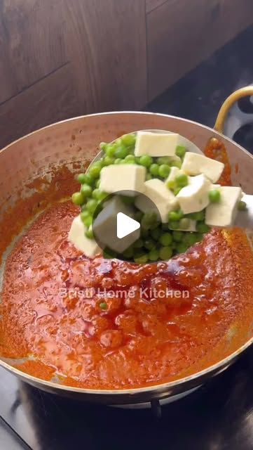 a pot filled with sauce and cheese on top of a stove