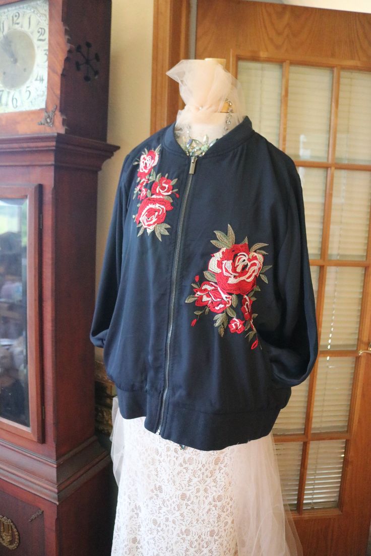 1940s 1950s style vintage inspired bombers jacket appliqued jacket. Embroidered on the sleeves & hems, together with multicolored floral appliques. One size fits all. Oversized Embroidered Outerwear For Spring, Spring Oversized Embroidered Outerwear, Spring Outerwear With Floral Applique And Long Sleeve, Spring Long Sleeve Outerwear With Floral Applique, Spring Floral Applique Long Sleeve Outerwear, Retro Embroidered Fall Outerwear, Oversized Embroidered Outerwear For Fall, Winter Cotton Outerwear With Embroidered Cuffs, Spring Cotton Outerwear With Embroidered Cuffs