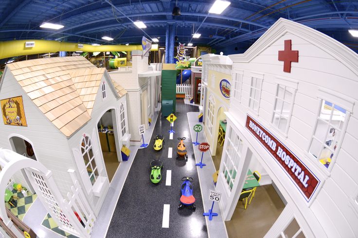 an aerial view of a toy hospital with children's toys on the floor and inside