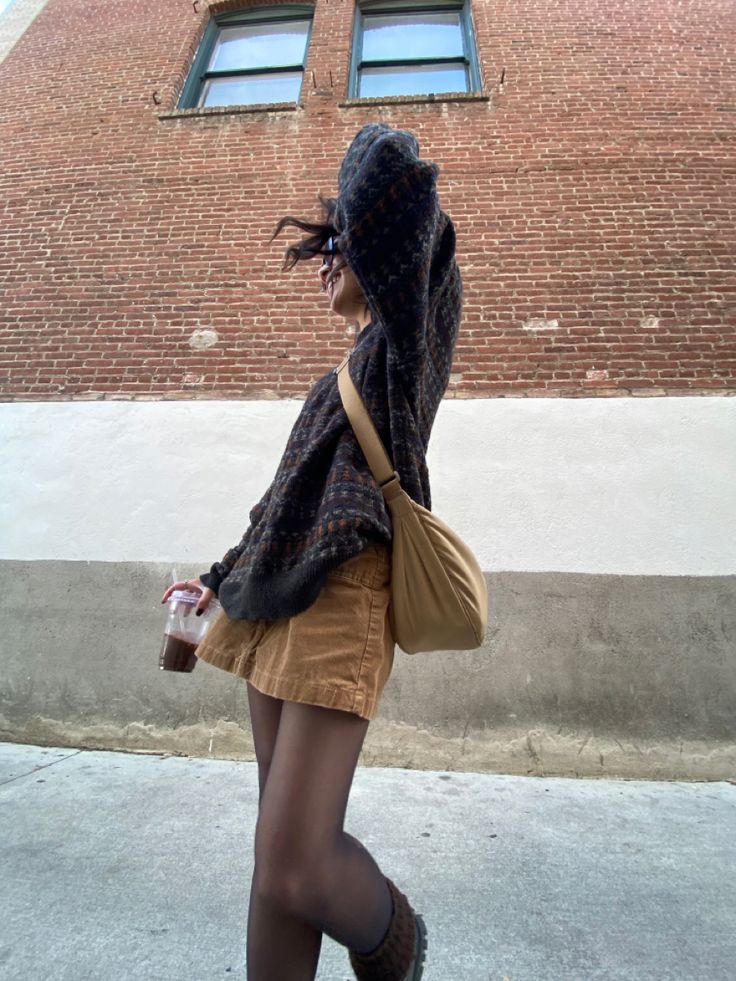 Fit inspo, ootd, fit pic, grandpa sweater, fuzzy sweater, brown sweater, uniqlo crescent bag, uniqlo side bag, uniqlo crescent tan bag, corduroy mini skirt, mini skirt, corduroy skirt, black tights, docs, brown leg warmers, sunglasses, iced latte, aesthetic, cute, vintage, thrift Beige Corduroy Skirt Outfit, Uniqlo Corduroy Bag, Cord Skirt Outfit Winter, How To Style Knee Length Skirt, Brown Cord Skirt Outfit, Uniqlo Crescent Bag Outfit, Courdory Skirt Outfits Fall, Mini Brown Skirt Outfit, Brown Courdory Skirt Outfit