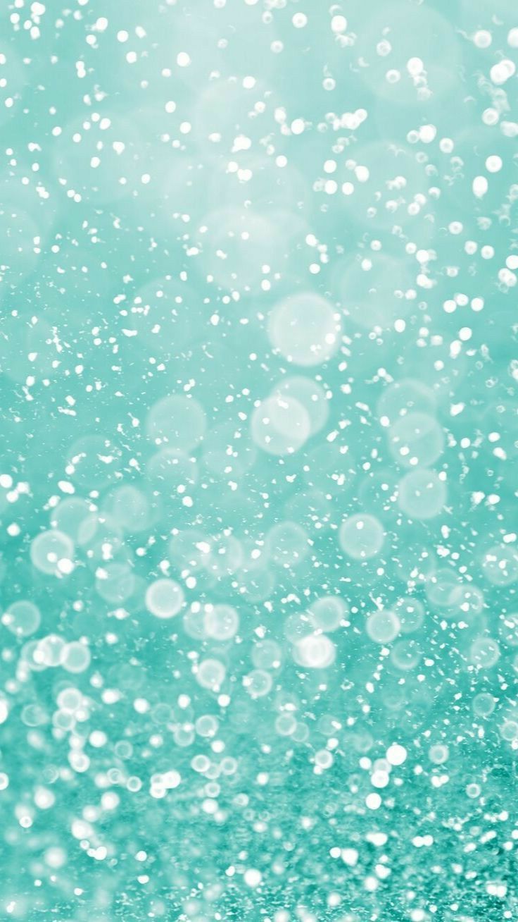 an abstract photo of water bubbles on a blue and green background with white dots in the middle