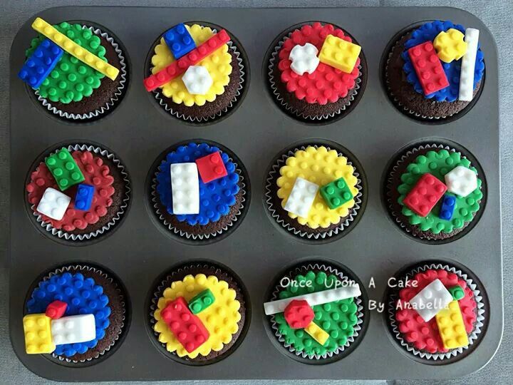 cupcakes made to look like legos are in a pan