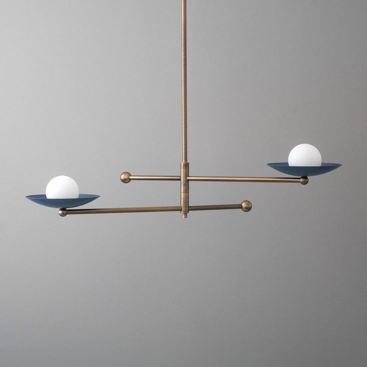 three lights hanging from the ceiling in a room