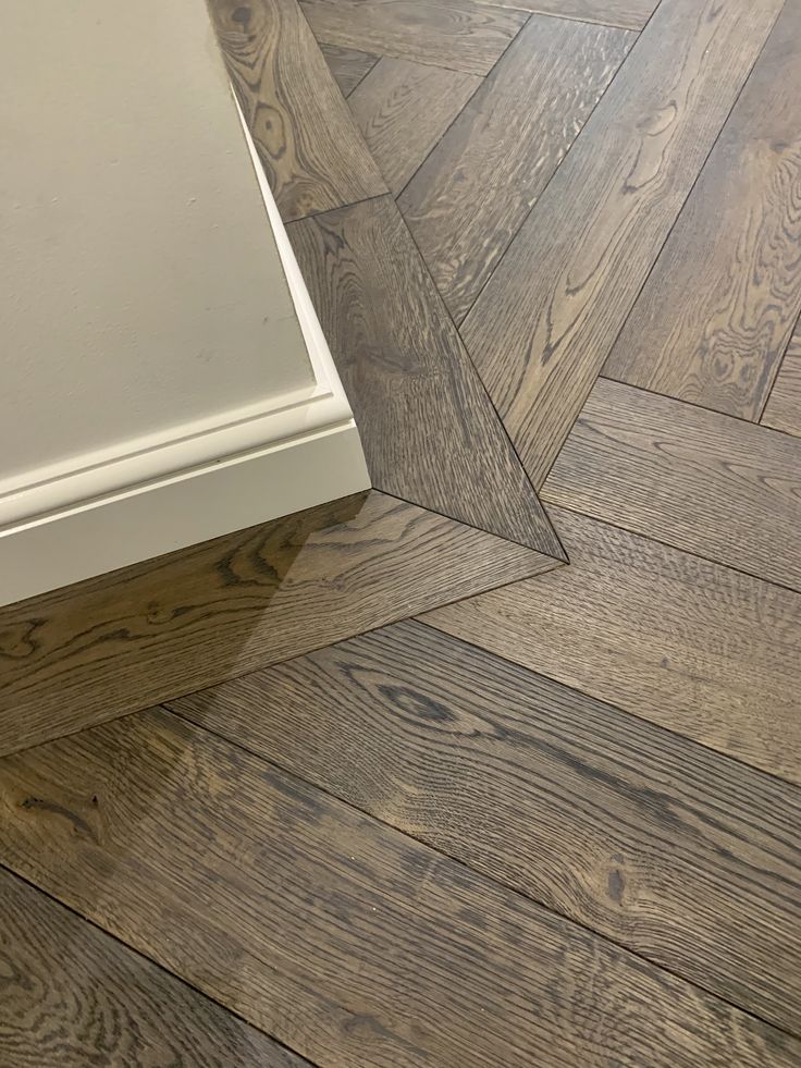 an image of wood flooring that looks like herringbones