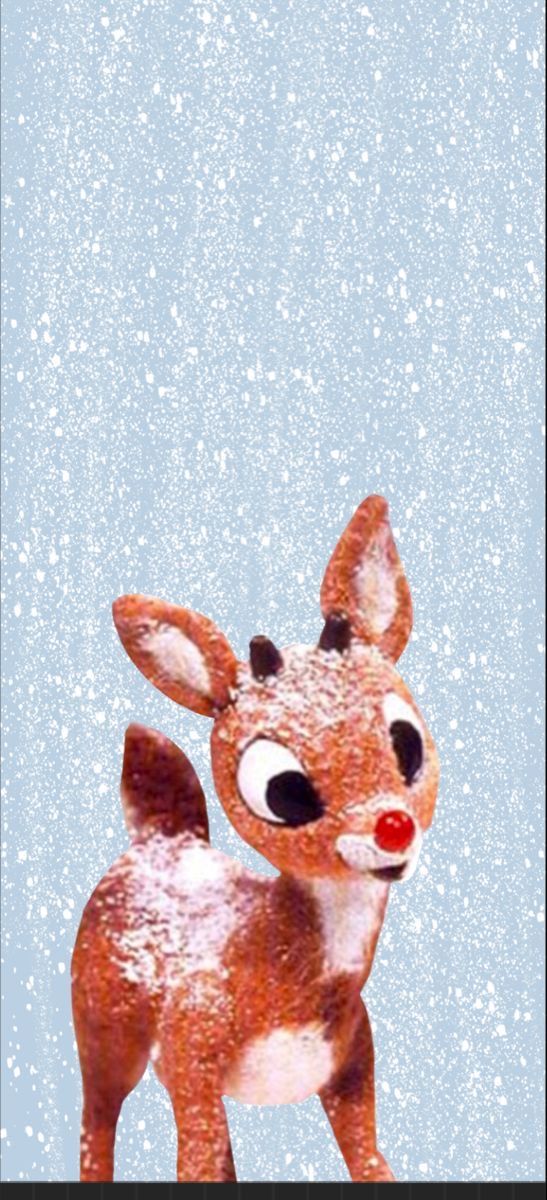 a little deer with big eyes standing in the snow