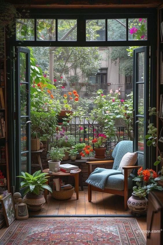 a room filled with lots of plants and furniture