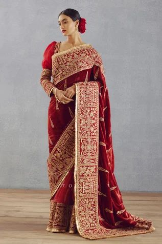 Red saree in a butterfly net base with gold thread and sequin embroidery, silk velvet pallu and a fringe border.
Component: 1
Pattern: Embroidery
Type Of Work: Thread and Sequin
Fabric: Silk Velvet and Butterfly Net
Color: Red
Other Details: 
Floral and peacock motifs
Fringe detail on the border
Broad embroidered border
Note: Blouse worn by the model is not for sale
Occasion: Wedding - Aza Fashions Red Saree Blouse, Net Embroidery, Butterfly Net, Saree For Women, Red Thread, Red Saree, Indian Fashion Designers, Sequins Embroidery, Silk Organza