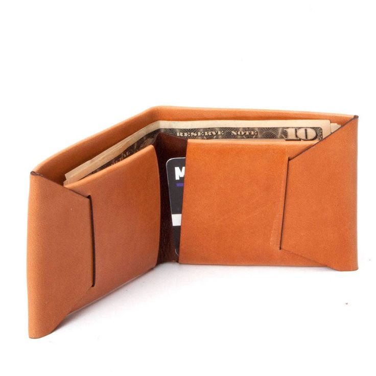 M&U has brought back its classic stitchless wallet, crafted using a single piece of leather. Features a cash sleeve and two card pockets. This classic wallet is handmade using custom Italian-made vegetable tanned leather, and will age beautifully with use. M&UMade in Nashville, US 100% vegetable tanned leather 3" by 3.75" (folded) Origami Wallet, Small Leather Wallet, Leather Diy Crafts, Leather Product, Bag Diy, Leather Wallets, Aging Beautifully, Minimalist Wallet, Leather Products