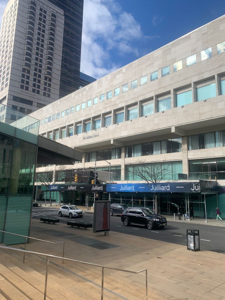 cars are parked in front of an office building