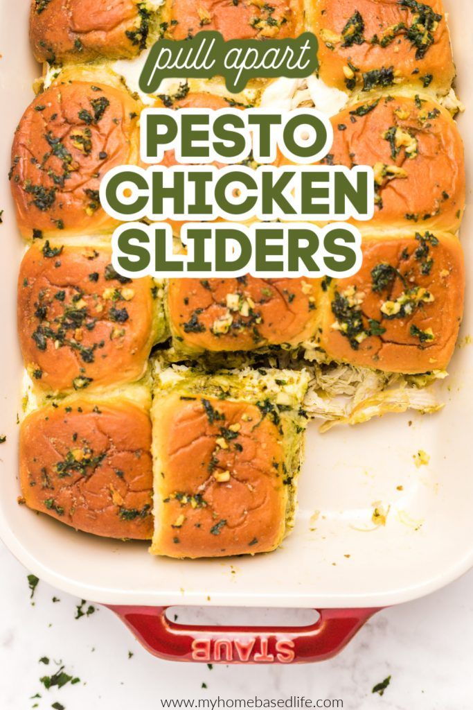 a casserole dish with pesto chicken sliders in it and the title overlay reads pull apart pesto chicken sliders