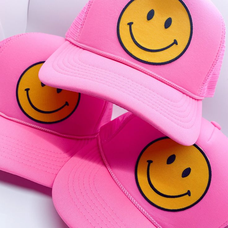 Keep it trendy with this new smiley face patch trucker hat! A best-seller, these hats are adjustable and can fit just about any head. They're super comfortable too. The smiley face patch is sure to keep you smiling all day long! Fun Snapback Hat For Streetwear, Trendy Smiley Face Cap, Fun Trucker Hat For Streetwear, Trendy Smiley Face Baseball Cap, Funny Adjustable Trucker Hat For Streetwear, Trendy Smiley Face Hat With Curved Brim, Trendy Smiley Face Baseball Cap With Curved Brim, Trendy Curved Brim Hat With Smiley Face, Adjustable Smiley Face Cap