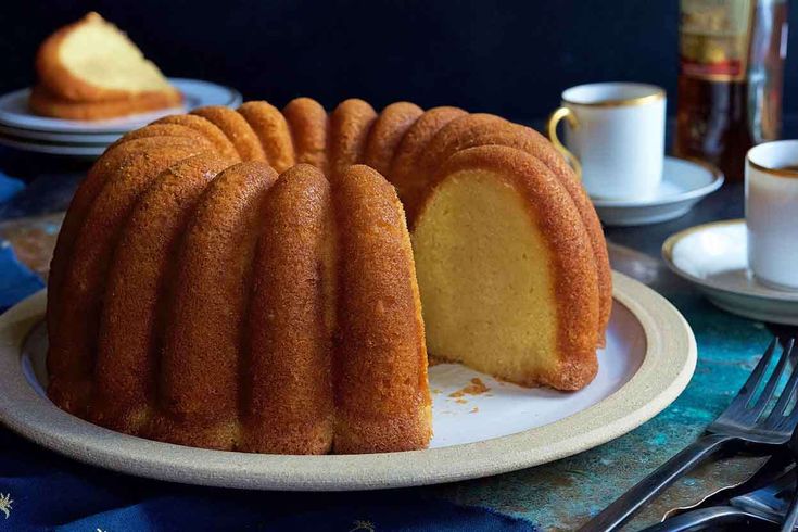 a bundt cake on a plate with a slice cut out