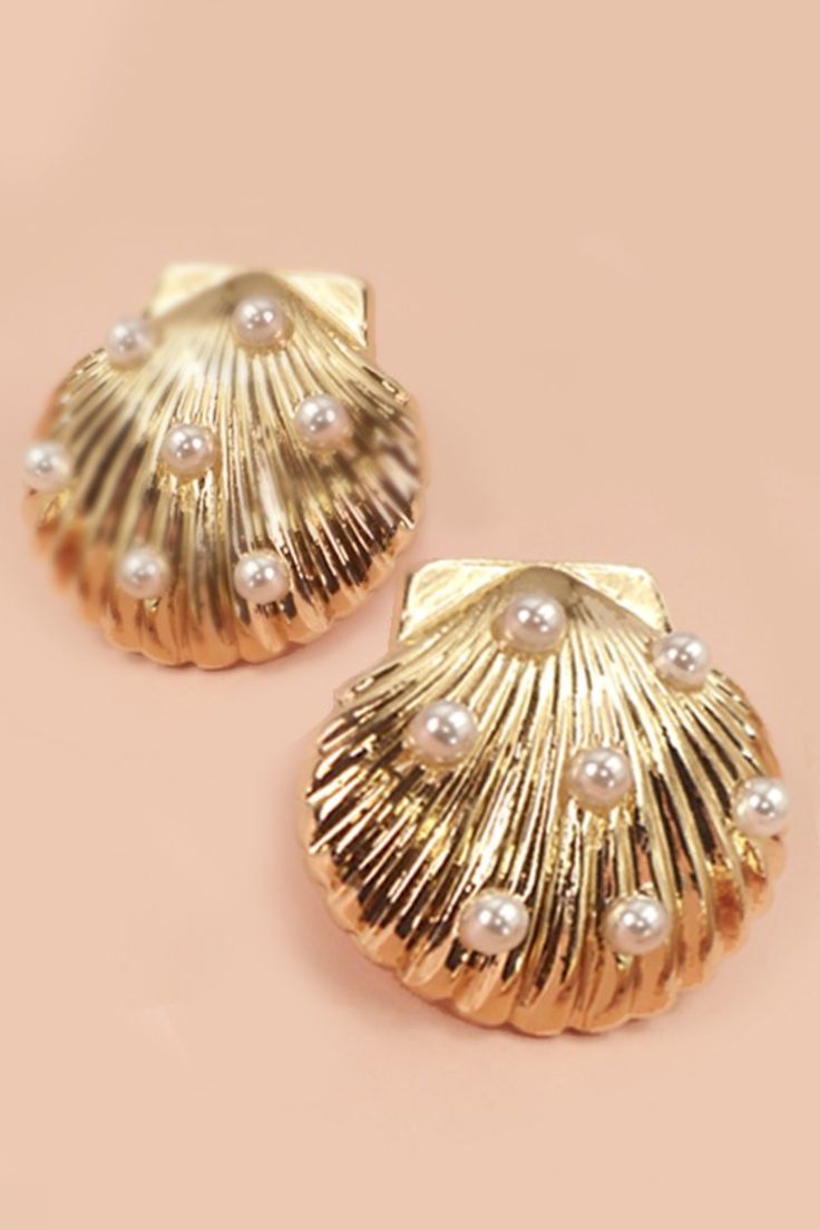 These earrings feature exquisite seashells delicately accented with lustrous pearls, evoking the serenity of the beach. Earrings are a final sale item Shell-shaped Pearl Earrings With Pearl Charm, Elegant Shell-shaped Earrings With Pearl Charm, Summer Pearl Earrings For Pierced Ears, Summer Pearl Earrings, Elegant Pearl Charm Earrings With Shell, Elegant Pearl Drop Mother Of Pearl Shell, Elegant Mother Of Pearl Shell With Pearl Drop, Gold Shell Pearl Charm Earrings, Elegant Shell Drop Earrings