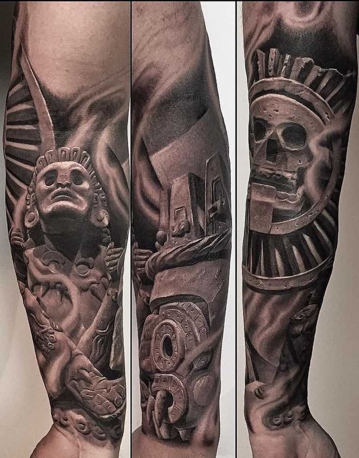 a man's leg with some tattoos on it