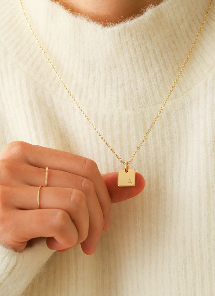 "This dainty gold necklace will be your new go-to minimalist pendant necklace! Personalize it with your or your loved one's initial - we stamp it for you. Made out of high quality gold plated & gold filled materials and perfect for everyday wear. It is an excellent layering necklace and is great as a gift for your friends and yourself! Other Personalized Necklaces: https://www.etsy.com/shop/AyouJewelry?section_id=31672095 D E T A I L S * 16K gold plated pendant * 14K gold filled necklace --- Gold Engraved Necklace, Custom Chain, Necklace Minimalist Jewelry, Necklace Name, Engraved Pendant, Gold Coin Necklace, Initial Necklace Gold, Dainty Gold Necklace, Gold Engraving