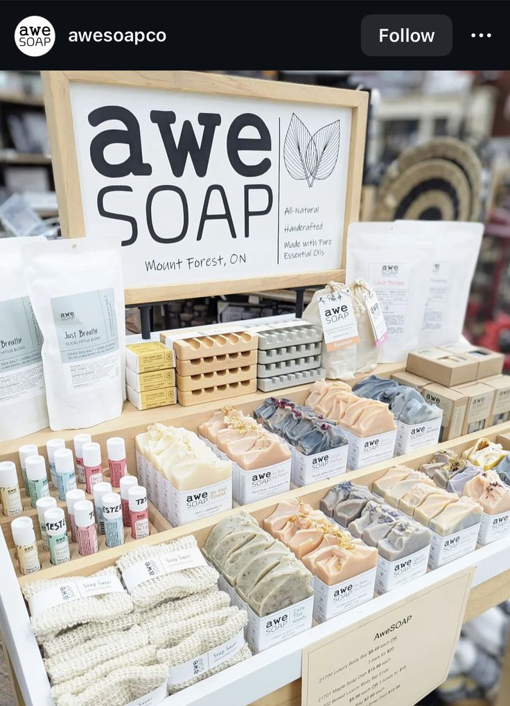 an assortment of soaps on display in a store