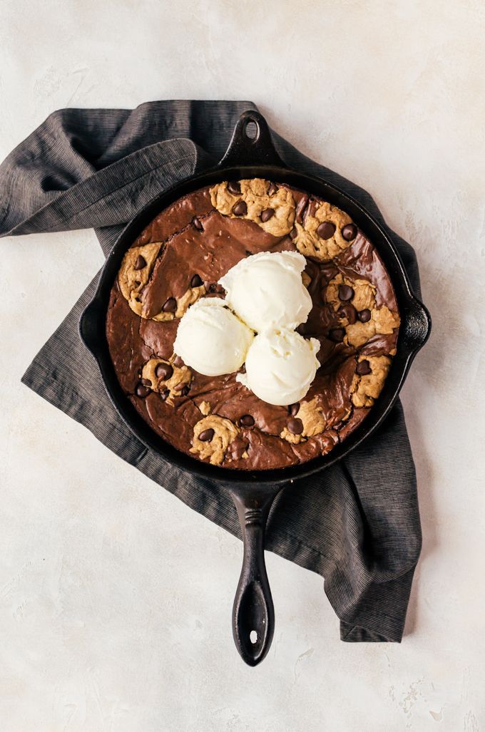 a skillet with ice cream and cookies on it, ready to be served in the oven