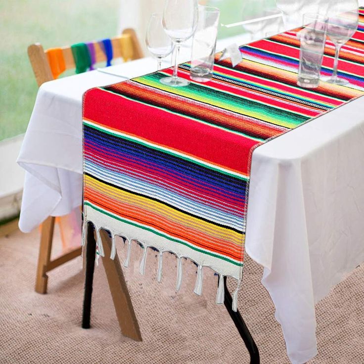 the table is set with colorful place mats