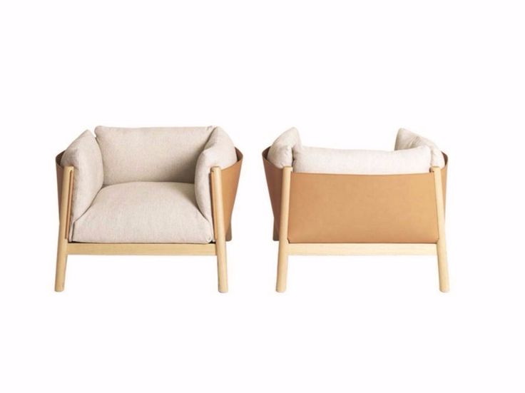 two chairs sitting next to each other on a white background