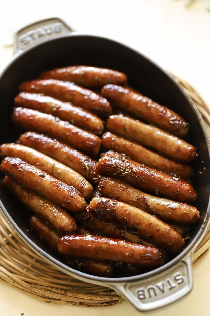 there are many sausages in the pan on the table