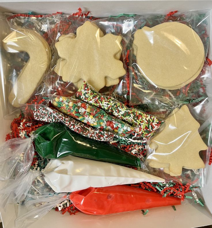 an assortment of cookies and candy in a box