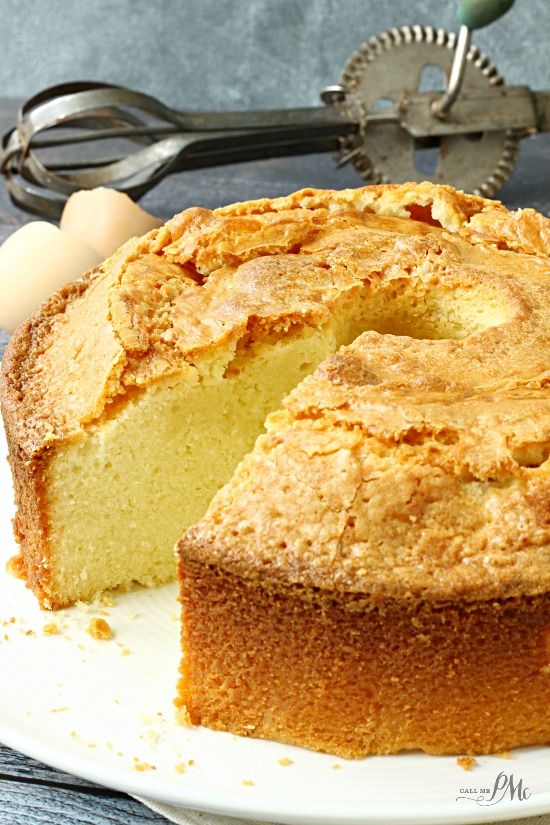 a close up of a cake on a plate with a slice cut out and ready to be eaten