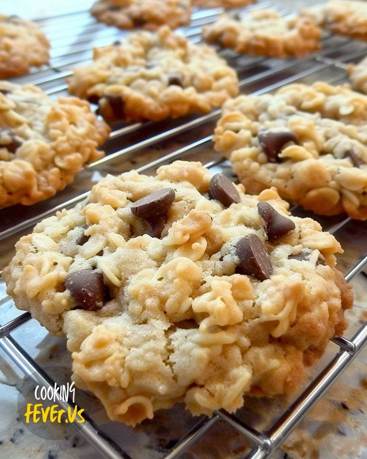 cookies cooling on a rack with chocolate chips and oatmeal in the middle