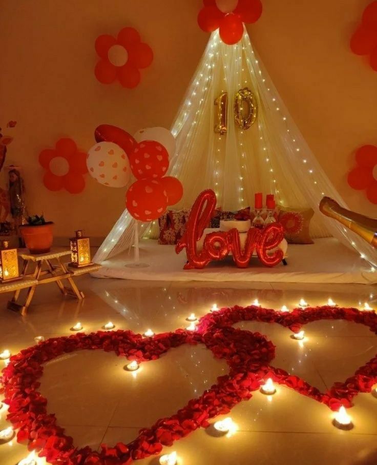 valentine's day decorations with candles and lights in the shape of heart shaped hearts