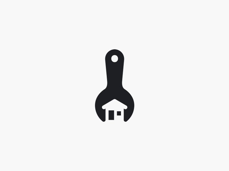 a black and white image of a house in the shape of a hand holding a wrench