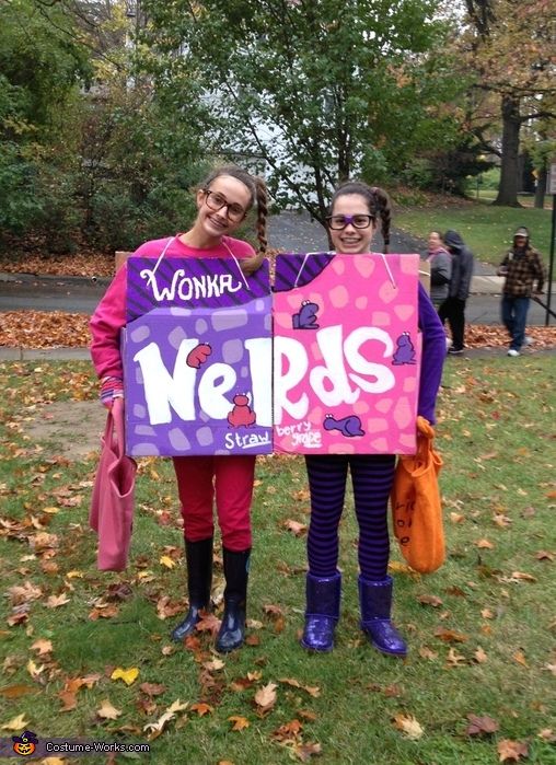 two women holding up a sign that says we r s