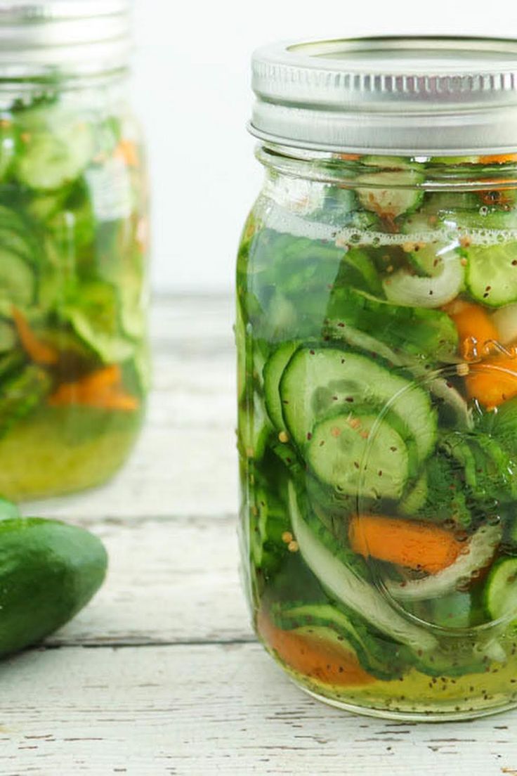 pickled cucumbers and carrots in a mason jar