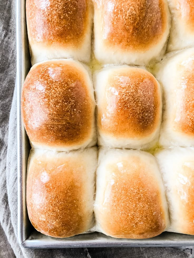 a pan filled with hot cross buns on top of a table