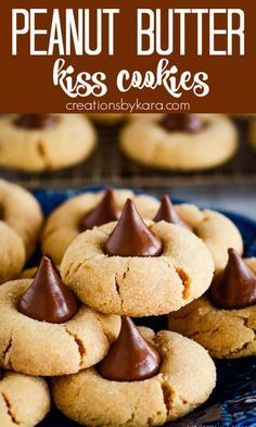 peanut butter kiss cookies on a blue plate with chocolate drizzled on top