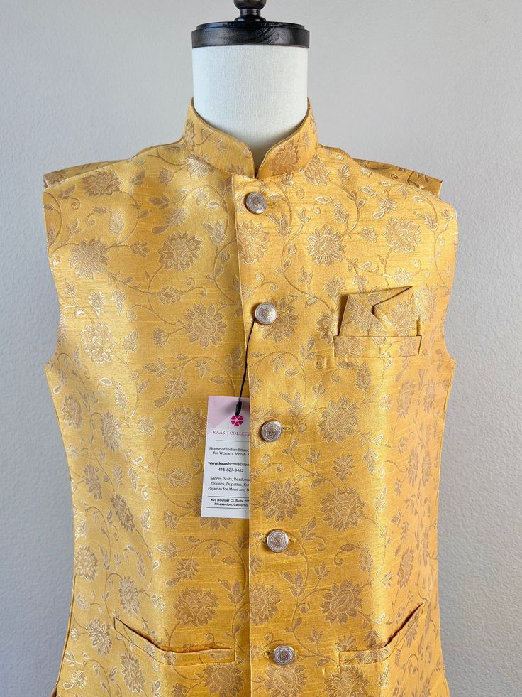 Premium quality Soft Silk Men's Waist Coat in Light Yellow Color based with Floral Weave with designer Buttons to add a great look. Can be paired with a Kurta Pajama Set. Item : Men's JacketReady to Wear : YesJacket Color : Light Yellow Fabric : Soft SilkWork : Fancy buttons, Self Deign Pattern Material Pattern : DesignerLining : Yes Measurements of the Jacket Size - 38Chest : 40 inches Length : 27 inches Size - 40Chest : 42 inches Length : 27 inches Size - 42Chest : 44 inches Length : 28 inches Size - 44 Chest : 45 inches Length : 28 1/2 inches Disclaimer-For sizing please refer to the Size Chart given in the listing with the pictures.- Please do NOT go by the size of the Jacket that you already have from another maker. All makers have different size Charts.- Size of the Jacket/Waist Coat Light Yellow Fabric, Indian Wedding Party, Nehru Jacket For Men, Designer Buttons, Light Yellow Color, Wedding Party Wear, Men's Ethnic Wear, Waist Coat, Fancy Buttons