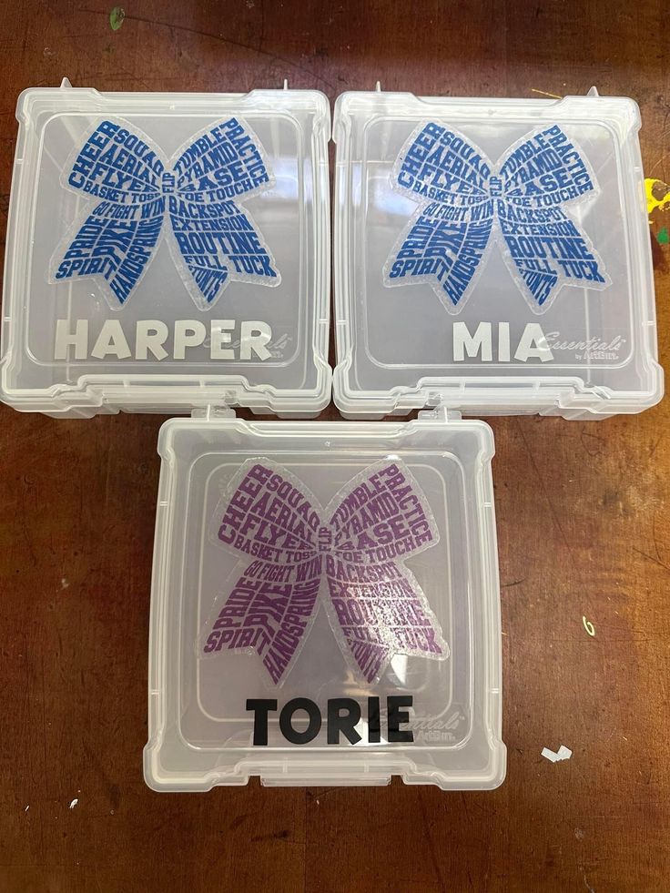 three plastic containers with purple and blue bows on them that say harper mia, tolie