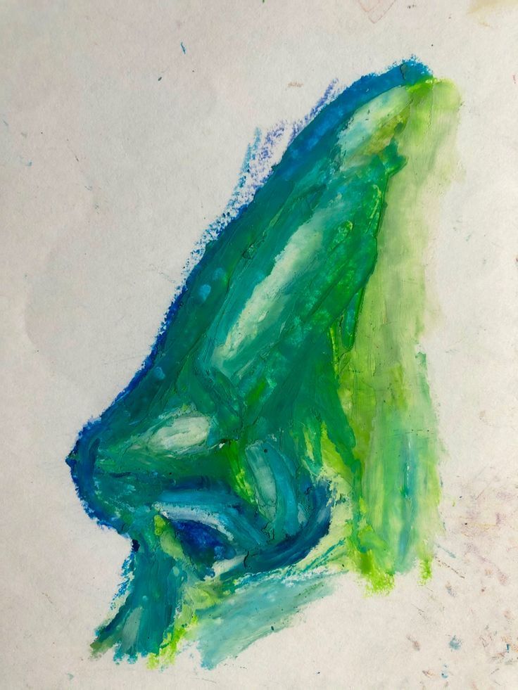 a painting with green and blue colors on white paper in the shape of a leaf