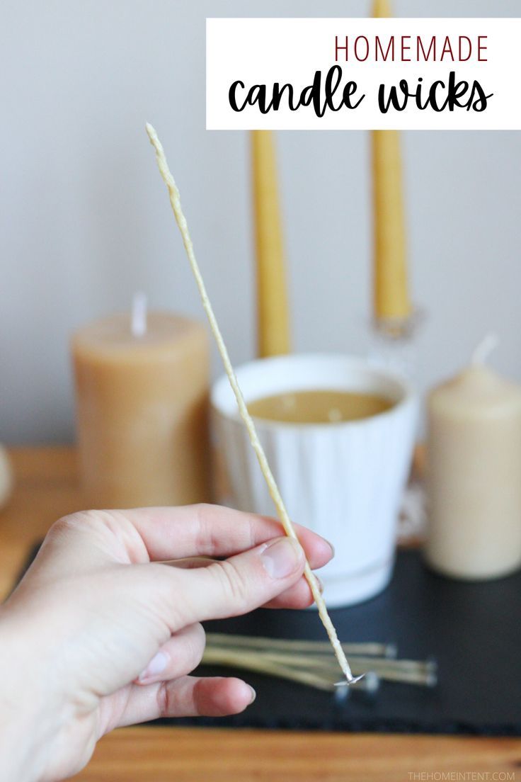 someone is holding some kind of stick with candles in the background and text overlay that reads homemade candle sticks