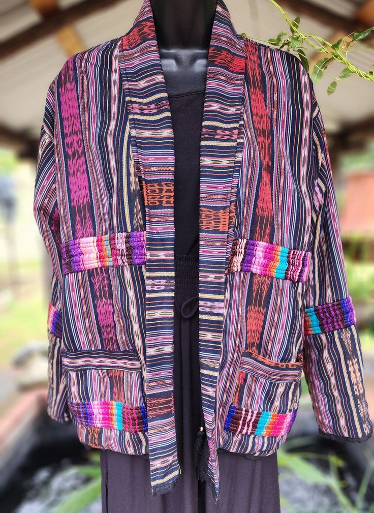 This jacket is Fully lined with two side pockets. Fade and wear resistant, using 100% organic cotton. This jacket is one of many from my current trip to Guatemala. A medium weight it will work best in fall or winter. I worked on this jacket when last in Guatemala. Visiting local homes in Chujul, the women we engaged graciously brought out all their materials and let me pick through them to my heart's content.  Material used in this jacket is extremely fine with a Silkey feel to it.  The jacket i Cotton Outerwear With Side Pockets And Long Sleeves, Cotton Cardigan With Patch Pockets For Fall, Fall Cotton Cardigan With Patch Pockets, Fall Cotton Blazer With Patchwork, Multicolor Cotton Blazer For Fall, Multicolor Winter Outerwear With Patch Pockets, Cotton Blazer With Multiple Pockets For Fall, Fall Cotton Blazer With Side Pockets, Casual Multicolor Blazer With Pockets