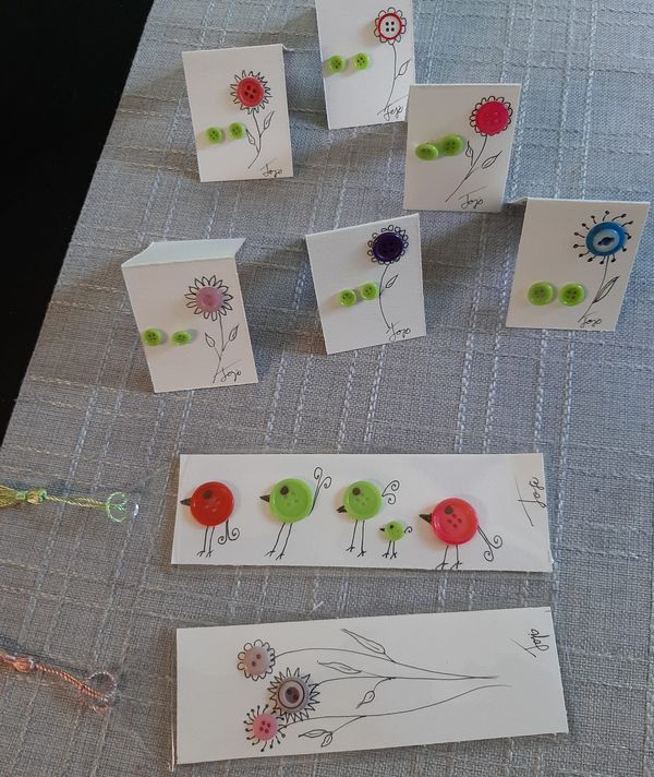 some little cards with flowers and birds on them