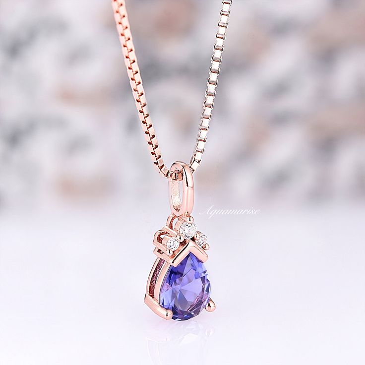 Exquisitely crafted Minimalist Teardrop Tanzanite Necklace, a stunning representation of elegance and sophistication. Meticulously designed for the contemporary woman with a penchant for timeless allure, this necklace seamlessly marries the understated charm of minimalism with the captivating allure of Tanzanite, all delicately embraced by the lustrous 14K Rose Gold Vermeil.►The pendant features a gracefully sculpted teardrop-shaped lab-created Tanzanite gemstone, renowned for its enchanting vio Elegant Oval Pendant Drop Necklace For Gift, Elegant Pear-shaped Drop Necklace Gift, Rose Gold Teardrop Pendant Necklace For Formal Occasions, Dainty Pear-shaped Necklace For Formal Occasions, Elegant Rose Gold Teardrop Pendant Necklace, Pear-shaped Rose Gold Necklace For Formal Occasions, Elegant Rose Gold Teardrop Necklace, Formal Rose Gold Teardrop Drop Necklace, Elegant Pear-shaped Rose Gold Necklace