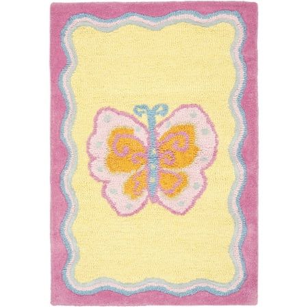 a yellow and pink rug with a butterfly on the front, sitting on a white floor